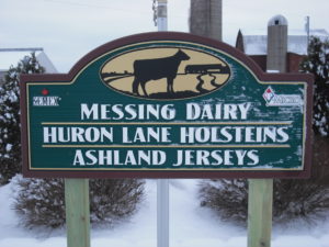 The farm sign that is near the driveway at my family's dairy farm.