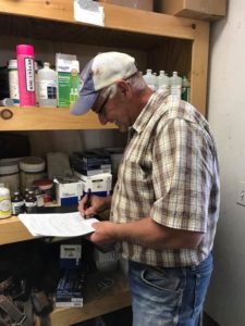 My dad signing the paperwork for the farm. We were officially farm owners. 